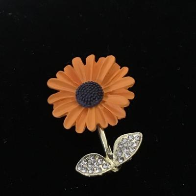 Gold tone orange flower pin