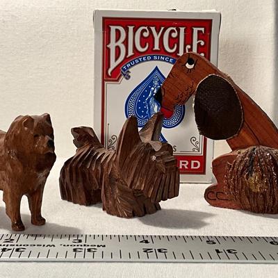 Trio of wood folk art carved dogs