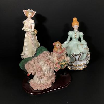 LOT 43L: Fancy Lady Figurines - 2002 Vanmark Enchanted Gardens 'Felicia,' Porcelain Doll Music Box & CTF Lady w/ Ruffled Dress on Couch