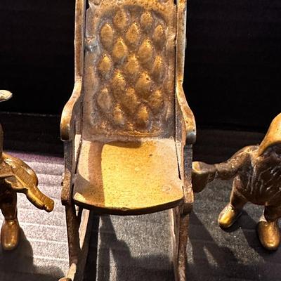 brass rocking chair with two solid brass figurines