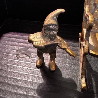 brass rocking chair with two solid brass figurines