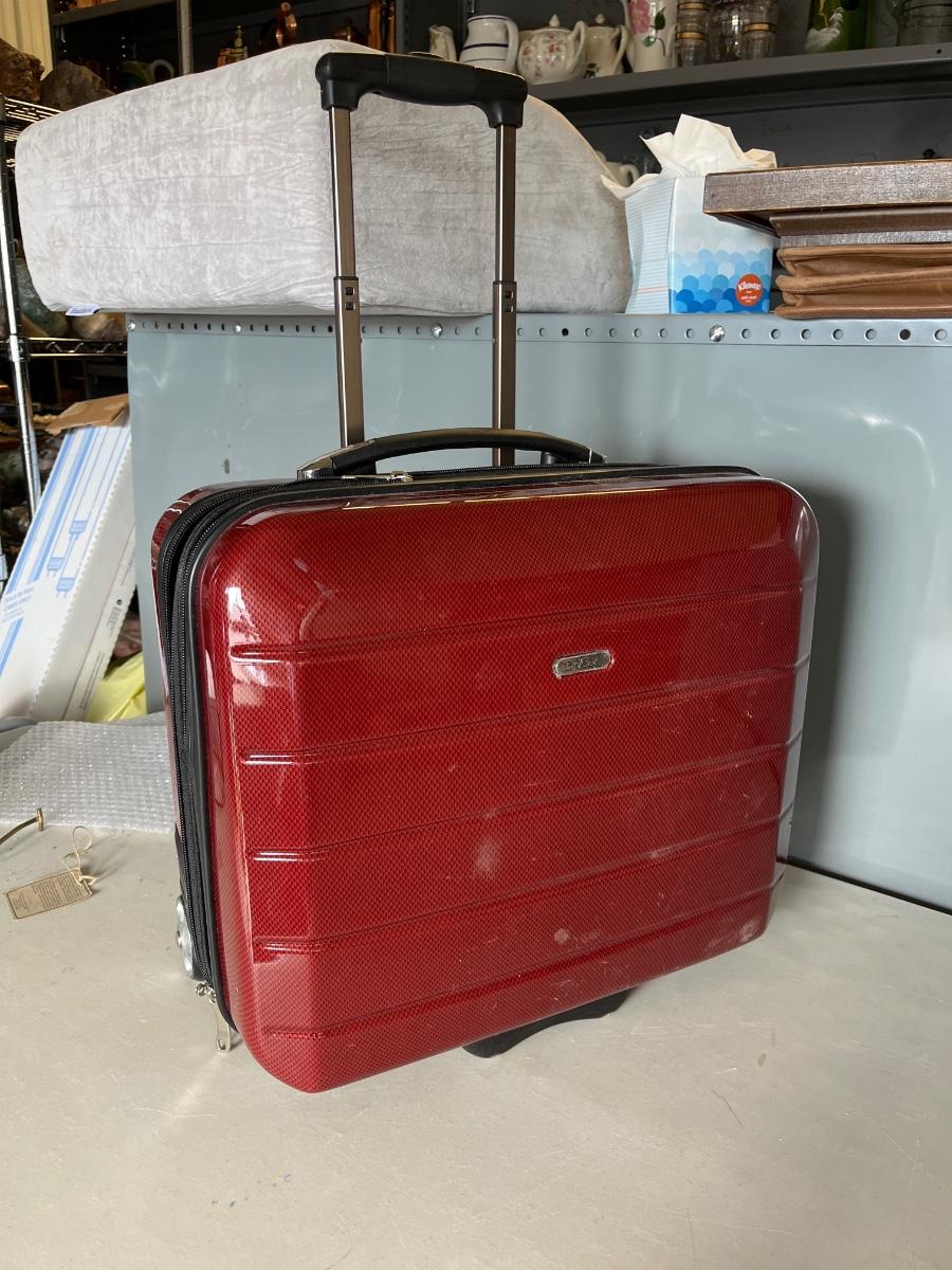135 Divoga overnight rolling suitcase EstateSales