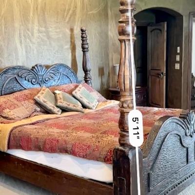 Beautiful hand carved king size bed, headboard, and footboard. Tempur-pedic mattress, sheets, and pillows included.