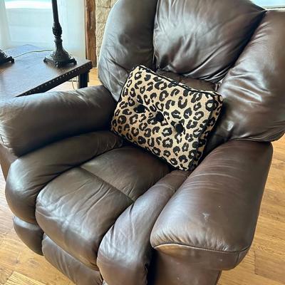 Lazy Boy Brown rocker recliner, 2 lamps, pillow, side table with iron legs and a faux tree