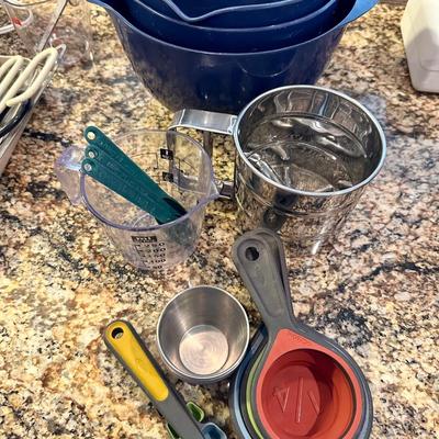 All measuring utensils, sifter and stainless cups