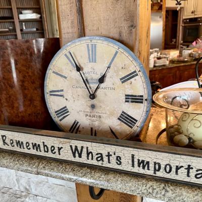 Sign and clocks, trash basket and more decor