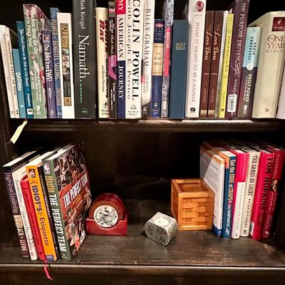 Books on 2 shelves, coasters, basket and candle