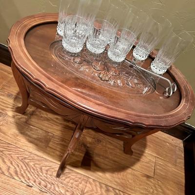 Oval mirror and table with glasses