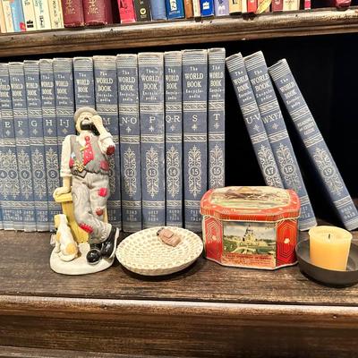Set of pretty World books and clown figurine, tin, candle, frame and bowl
