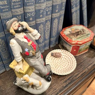 Set of pretty World books and clown figurine, tin, candle, frame and bowl