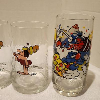 Vintage Collector glasses including four Wizard of Oz glasses