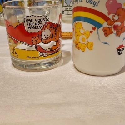 Vintage Collector glasses including four Wizard of Oz glasses