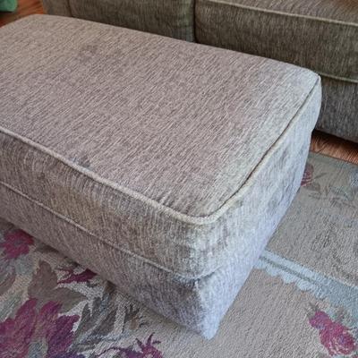 Ashley Furniture Industries Small Sofa with Footstool and two throw pillows