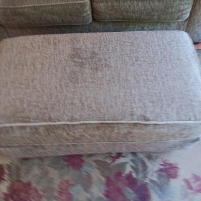 Ashley Furniture Industries Small Sofa with Footstool and two throw pillows