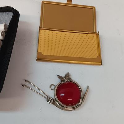 Sunglass lenses with cases - small travel sewing kit - metal wallet - and more