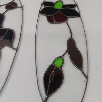 Two stained - glass floral window decor pieces