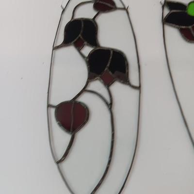 Two stained - glass floral window decor pieces