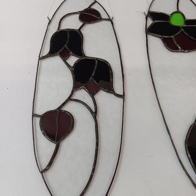 Two stained - glass floral window decor pieces