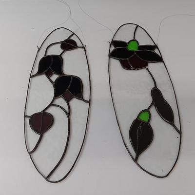 Two stained - glass floral window decor pieces