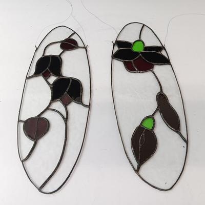 Two stained - glass floral window decor pieces