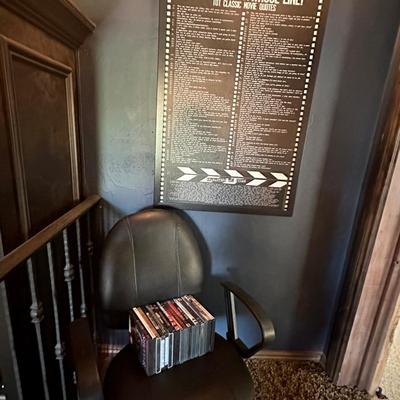 Movie poster, lot of DVDs and an office chair