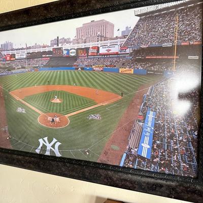Telescope, small shuffleboard game and NY Yankees art