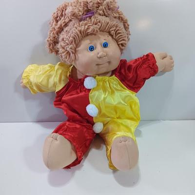 Collectible Cabbage Patch girl doll with clown outfit