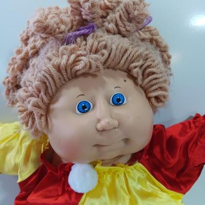 Collectible Cabbage Patch girl doll with clown outfit