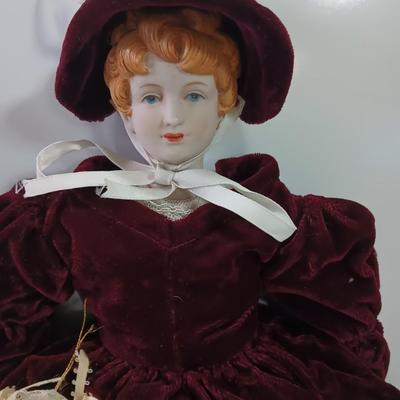 Three collectible dolls - porcelain with cloth bodies