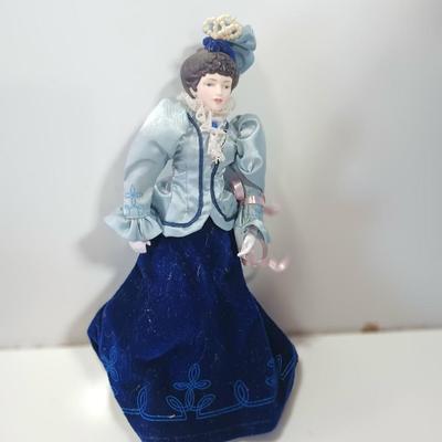 Three collectible dolls - porcelain with cloth bodies