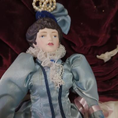 Three collectible dolls - porcelain with cloth bodies