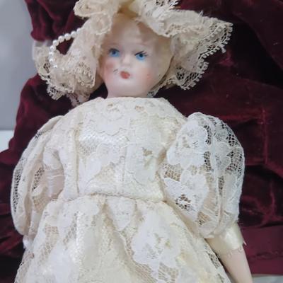 Three collectible dolls - porcelain with cloth bodies