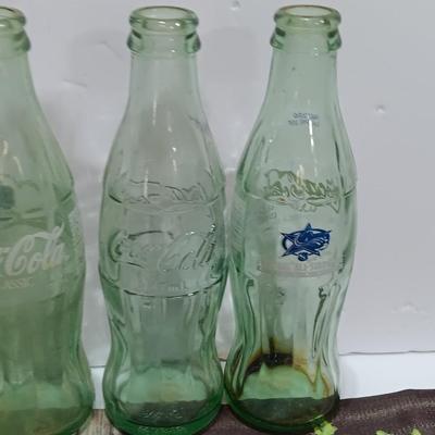 Coca Cola collectibles - bottles - cards - glasses and a tapestry