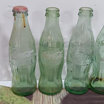 Coca Cola collectibles - bottles - cards - glasses and a tapestry