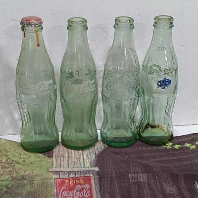 Coca Cola collectibles - bottles - cards - glasses and a tapestry
