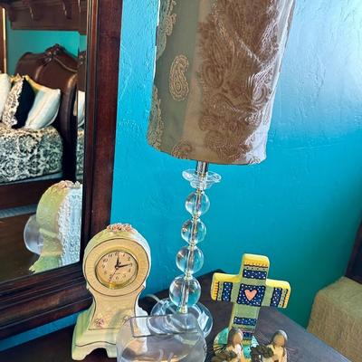 A trendy lamp To decorate any room. A clock, a cross, girl, figurines