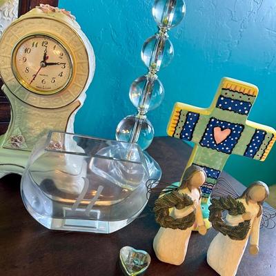 A trendy lamp To decorate any room. A clock, a cross, girl, figurines