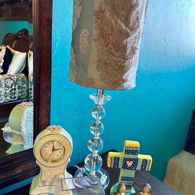 A trendy lamp To decorate any room. A clock, a cross, girl, figurines