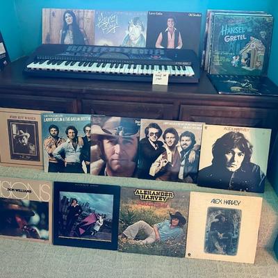 Vinyl records lot with small electric Keyboard