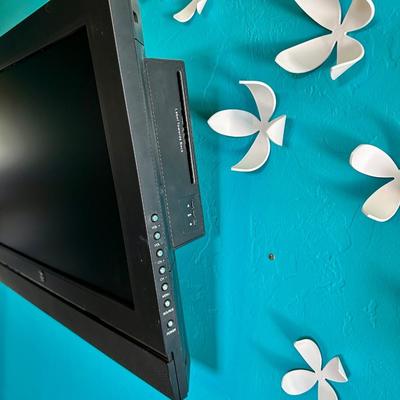 35 inch TV with wall mount and magnetic wall decor