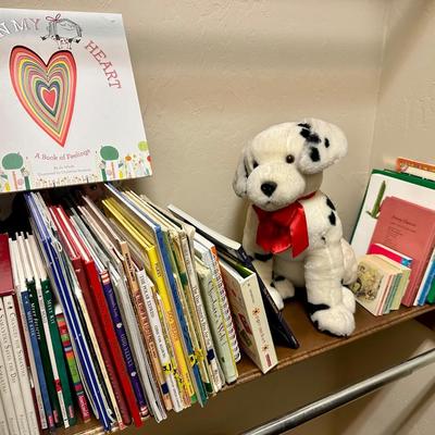 Children’s books and a dog stuffed animal