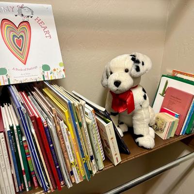 Children’s books and a dog stuffed animal