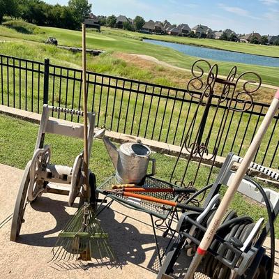 Two Hose reels, water pail and outdoor garden tools and accessories