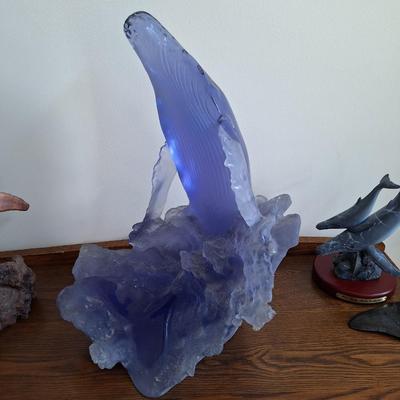 blue glass breaching whale