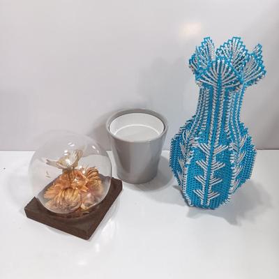 Vintage Taxidermy butterfly cloche dome with small ceramic plant pot and a blue decorative vase