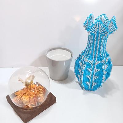 Vintage Taxidermy butterfly cloche dome with small ceramic plant pot and a blue decorative vase
