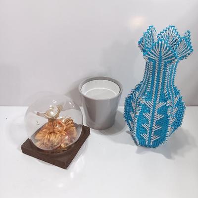Vintage Taxidermy butterfly cloche dome with small ceramic plant pot and a blue decorative vase