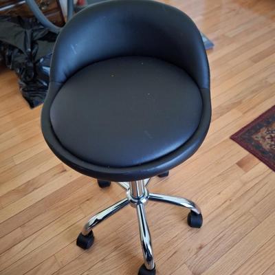 black rolling stool