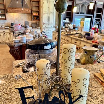House decor including candles, paper towels holder and picture holder