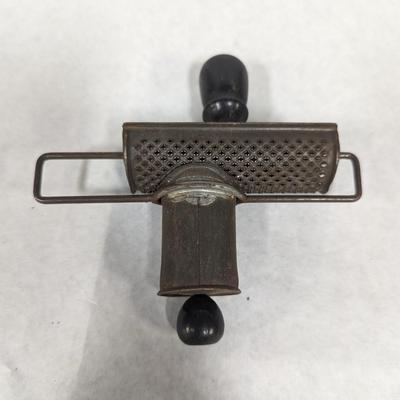 Nutmeg Grinder With Black Handles